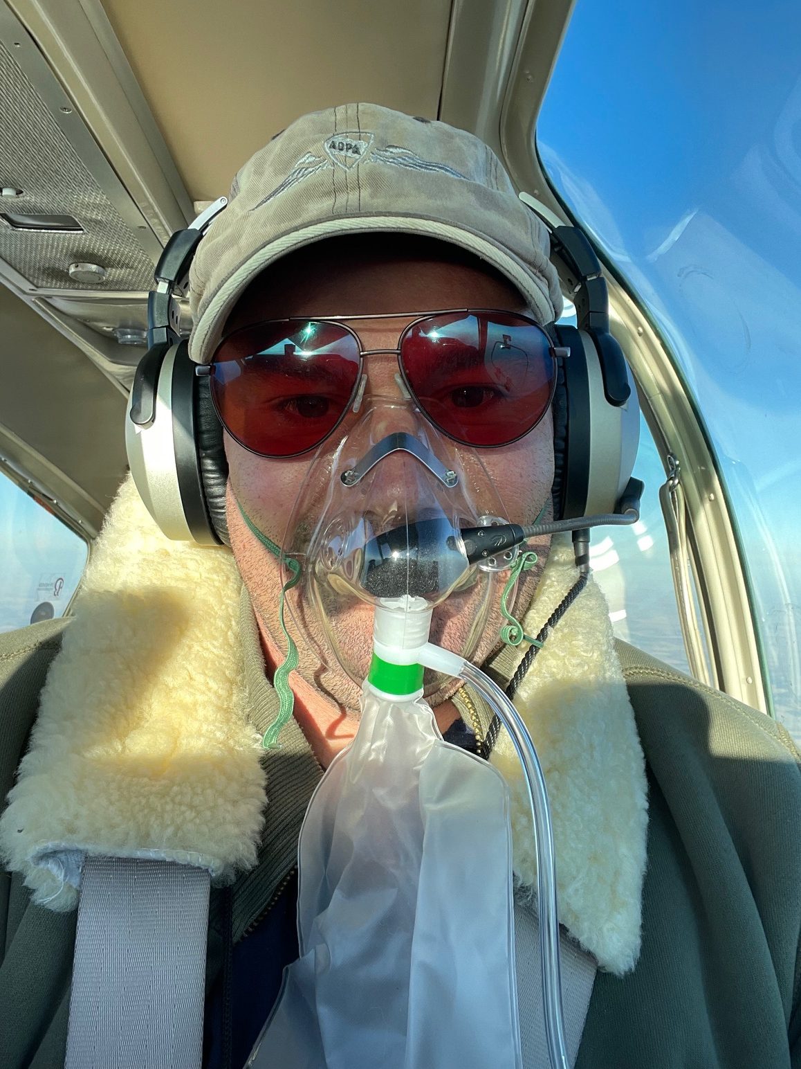 The author breathing supplemental oxygen at 15,500 over western Kansas.